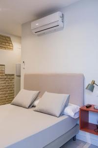 Postel nebo postele na pokoji v ubytování Valentin Suites