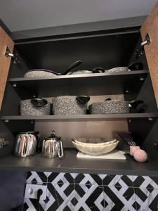 a shelf with pots and pans in a kitchen at Fatih / Aksaray - Yusufpaşa in Istanbul