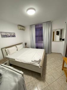 Postel nebo postele na pokoji v ubytování N&D Villa