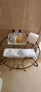 a glass table in a bathroom with a towel on it at Chateau de la Grand'Maison in Bellême +55 photos