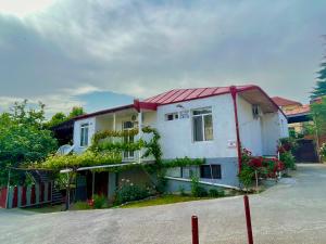a white house with a red roof at Elegance in Sighnaghi