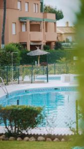 Bazén v ubytovaní Jardín del Golf Nº 36 by Fontanilla del Mar Holidays Rentals alebo v jeho blízkosti
