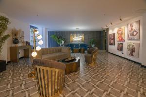 a living room with a couch and a table at First Class Hotel in Medellín