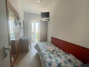 Voodi või voodid majutusasutuse Hotel Vianello toas
