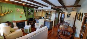 a living room with a couch and a fireplace at Apto. Edificio Lysandra, Anciles in Anciles