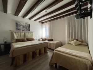 Cama ou camas em um quarto em Albergo Marin