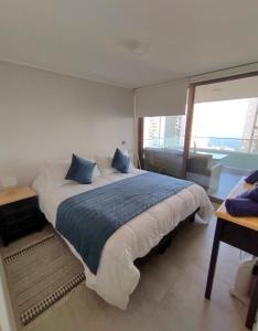 Postel nebo postele na pokoji v ubytování Alojamiento familiar con hermosa vista al mar