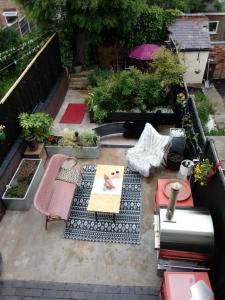 a patio with a table and chairs and plants at DERBY in Derby