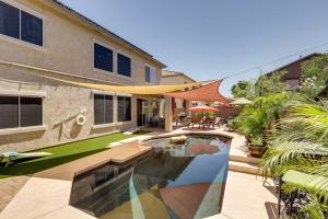 a backyard with a swimming pool and a house at Goodyear Home with Heated Pool, Near Spring Training in Goodyear