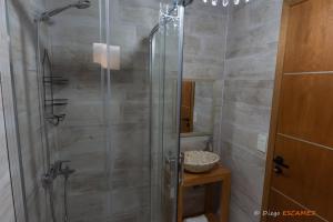a shower with a glass door in a bathroom at Departamento Lake Soul Villa La Angostura in Villa La Angostura