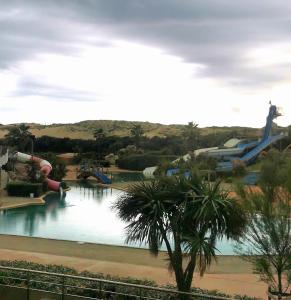 a view of a water park with a water slide at studio 222 à cent mètres de l'océan in Seignosse