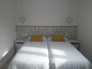 Łóżko lub łóżka w pokoju w obiekcie Casita con encanto entre viñedos