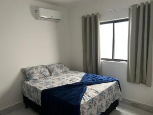 Giường trong phòng chung tại Carapibus casa de praia 02