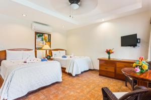 Voodi või voodid majutusasutuse SunBreeze Hotel toas