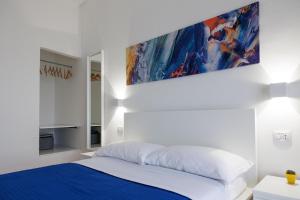 Letto o letti in una camera di B&B In Piazza