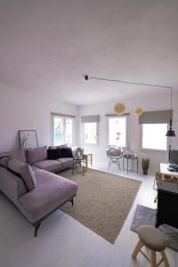 a living room with a couch and a rug at Villa Sofia Old Town in Kavala