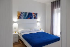 Letto o letti in una camera di B&B In Piazza