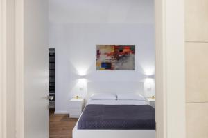 Letto o letti in una camera di B&B In Piazza