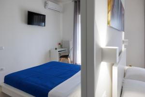 Letto o letti in una camera di B&B In Piazza
