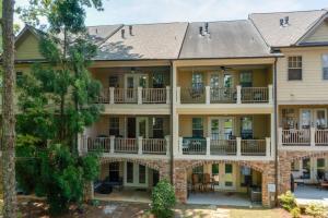 an image of a large house with balconies at Lake Oconee Abode with Patio, Grill and Fire Pit Table in Eatonton 
