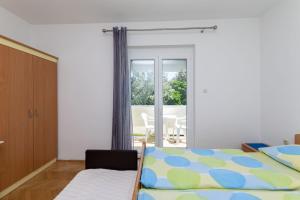Posteľ alebo postele v izbe v ubytovaní Apartments Marija Sabina