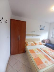 Posteľ alebo postele v izbe v ubytovaní Apartments Marija Sabina