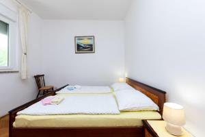 Posteľ alebo postele v izbe v ubytovaní Apartments Marija Sabina