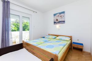 Posteľ alebo postele v izbe v ubytovaní Apartments Marija Sabina
