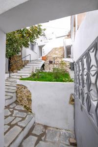 a stone walkway leading up to a building with stairs at Villa Sofia Old Town in Kavala