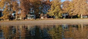 a house sitting next to a body of water at Villa Paradiso in Ohrid