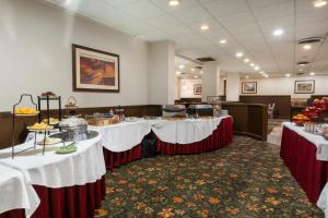 a conference room with tables with food on them at Ramada by Wyndham Reno Hotel & Casino in Reno +20 photos