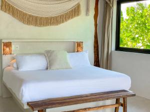 Ένα ή περισσότερα κρεβάτια σε δωμάτιο στο Amansala Resort