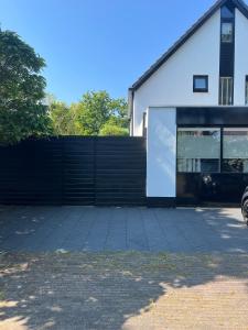 a black fence in front of a house at Chalet Parfait in Bergen
