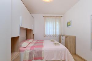 Postel nebo postele na pokoji v ubytování Appartment Ksenija 4
