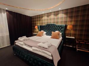 Postel nebo postele na pokoji v ubytování Palace Hotell