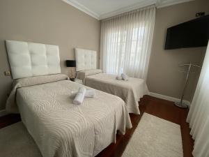 Postel nebo postele na pokoji v ubytování Villa OLYMPIA
