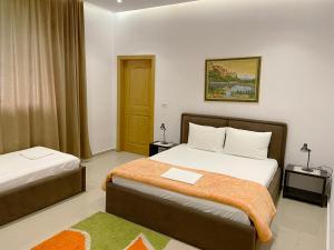 Postel nebo postele na pokoji v ubytování Guesthouse Niko