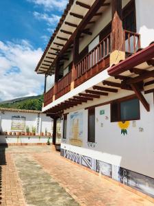 a building with a mural on the side of it at Hotel Villa Cristina in Villa de Leyva