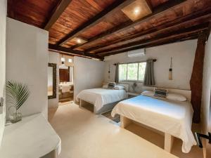 Ένα ή περισσότερα κρεβάτια σε δωμάτιο στο Amansala Resort
