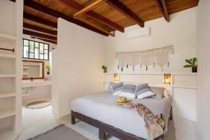 Ένα ή περισσότερα κρεβάτια σε δωμάτιο στο Amansala Resort