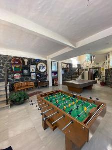 a living room with a pool table and a game room at Casa Don Pancho in Cuernavaca