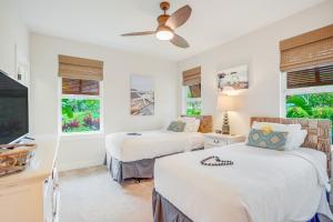 two beds in a room with two windows at Pili Mai 1A in Koloa