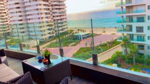 a balcony with a view of the beach and the ocean at MARINA APARTMENT OCEAN VIEW in Casablanca