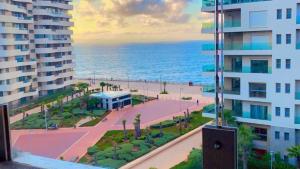 a view of the ocean from a balcony of a building at MARINA APARTMENT OCEAN VIEW in Casablanca