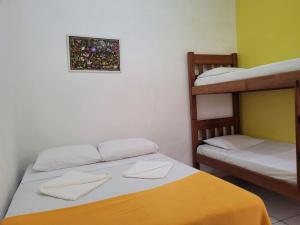Postel nebo postele na pokoji v ubytování Pousada Piçarras