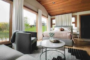 a living room with a couch and a table at Lake with Dock and Hot Tub Hocking Hills Cabin in Rockbridge