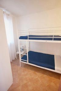 Posteľ alebo postele v izbe v ubytovaní Casa vacanze Magabù