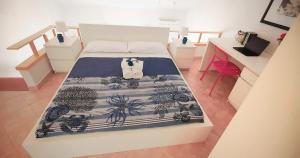 Posteľ alebo postele v izbe v ubytovaní Casa vacanze Magabù