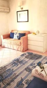 Posteľ alebo postele v izbe v ubytovaní Casa vacanze Magabù