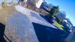 an overhead view of a driveway with a car parked on the road at D R Accommodation and Cozy Cabins, Hamilton East near to CBD and Waikato Hospital in Hamilton